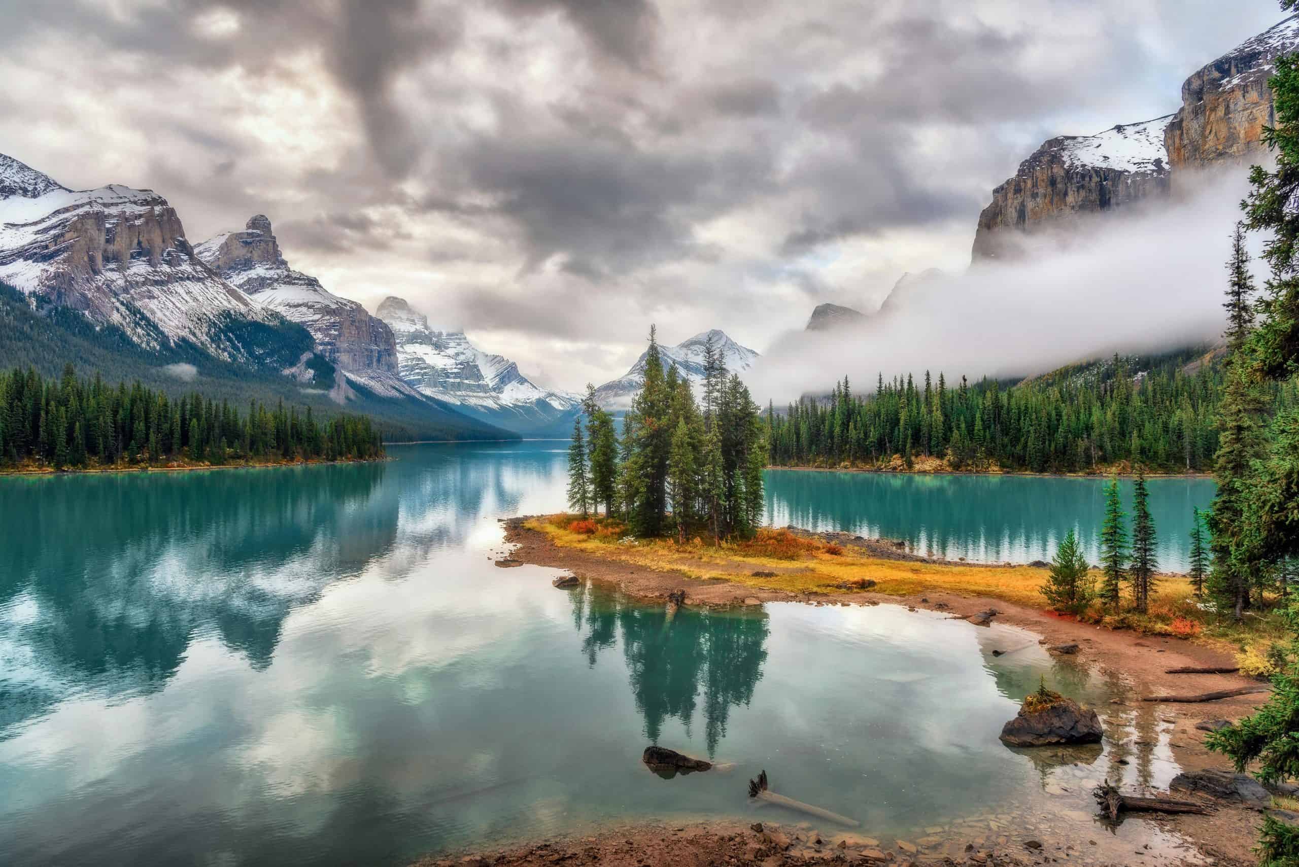 Serene mountain landscape reflecting on a still lake, symbolizing the Cognitive Hybrid Immersion Language Learning (CHILL) method.